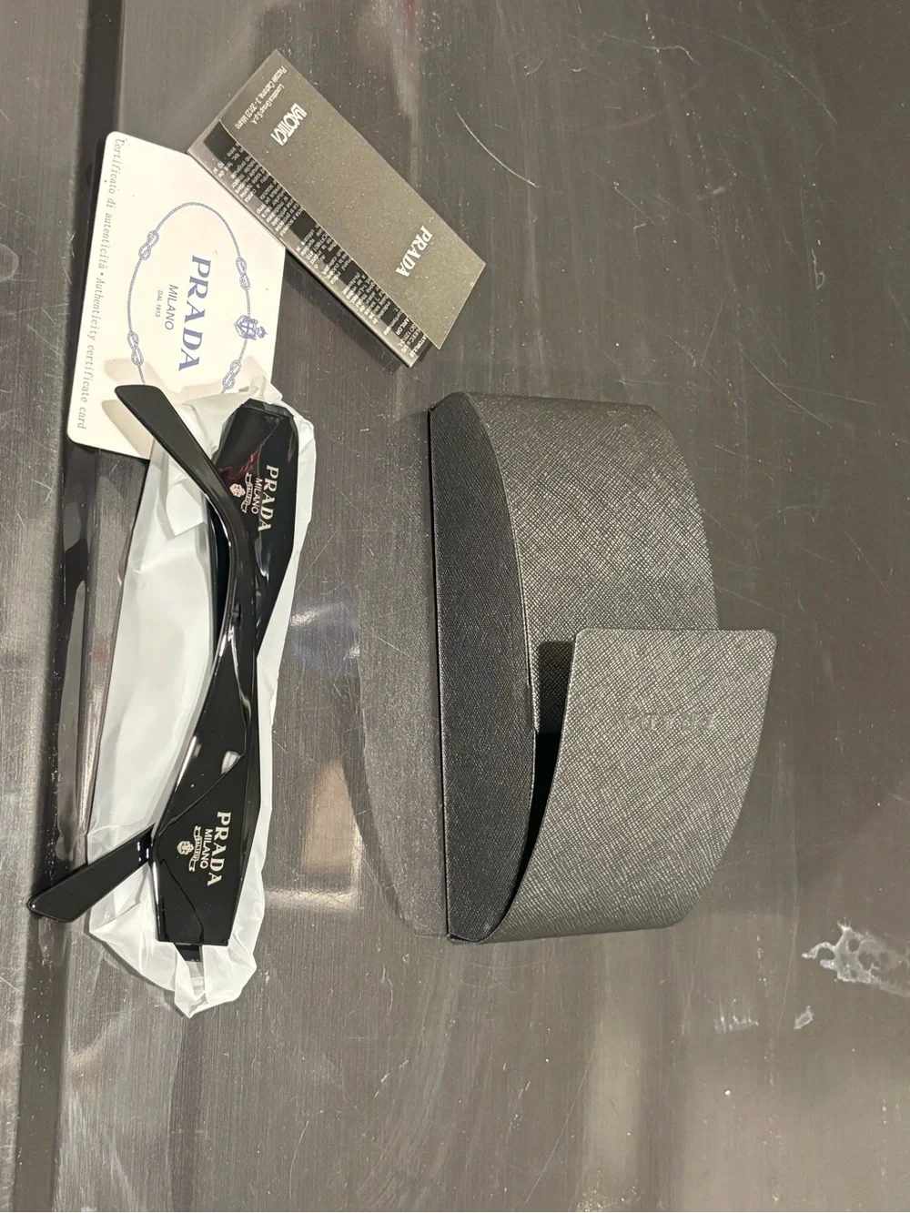 Prada Black Sunglasses with Textured Gray Case